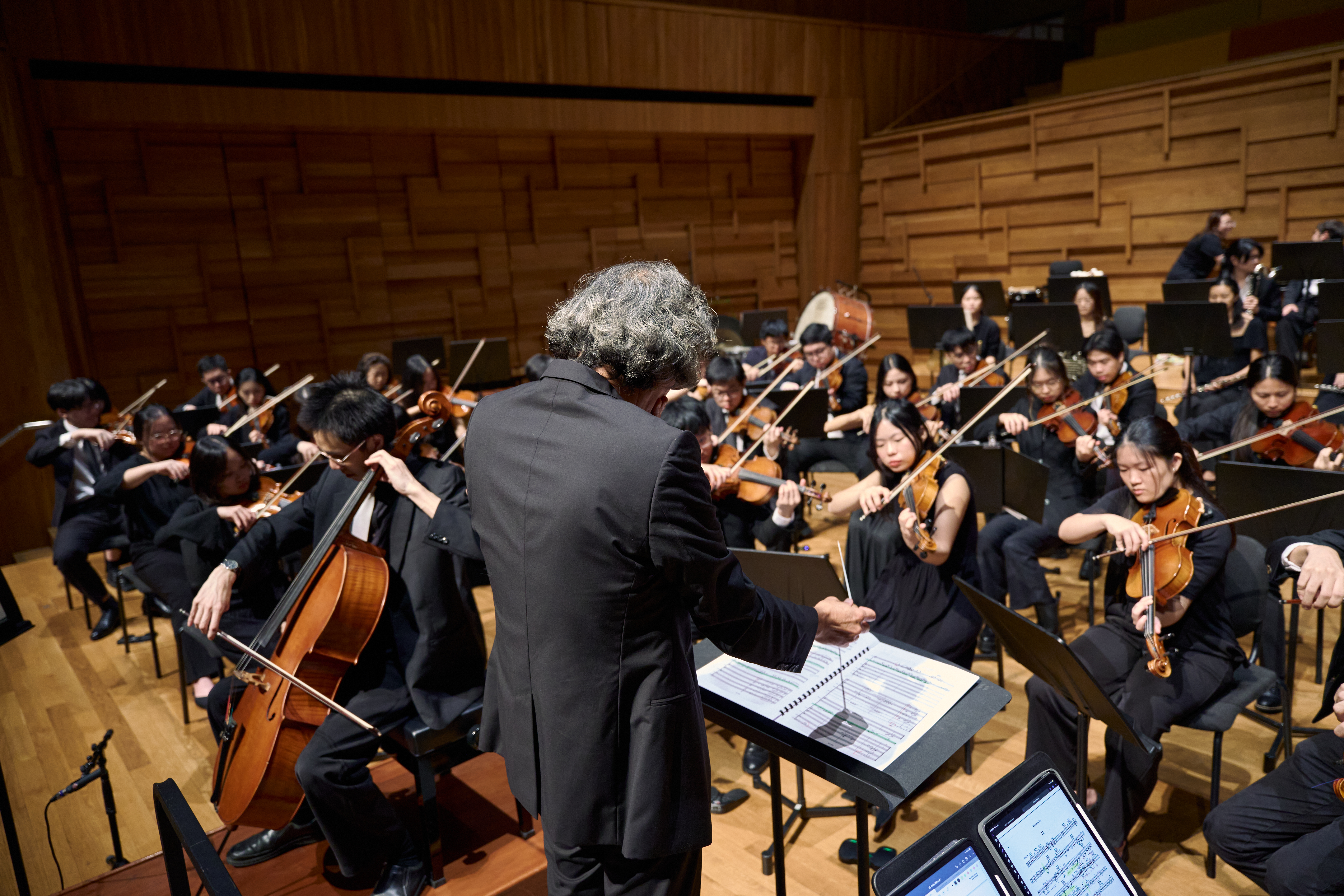 NTU Symphony Orchestra and conductor in performance