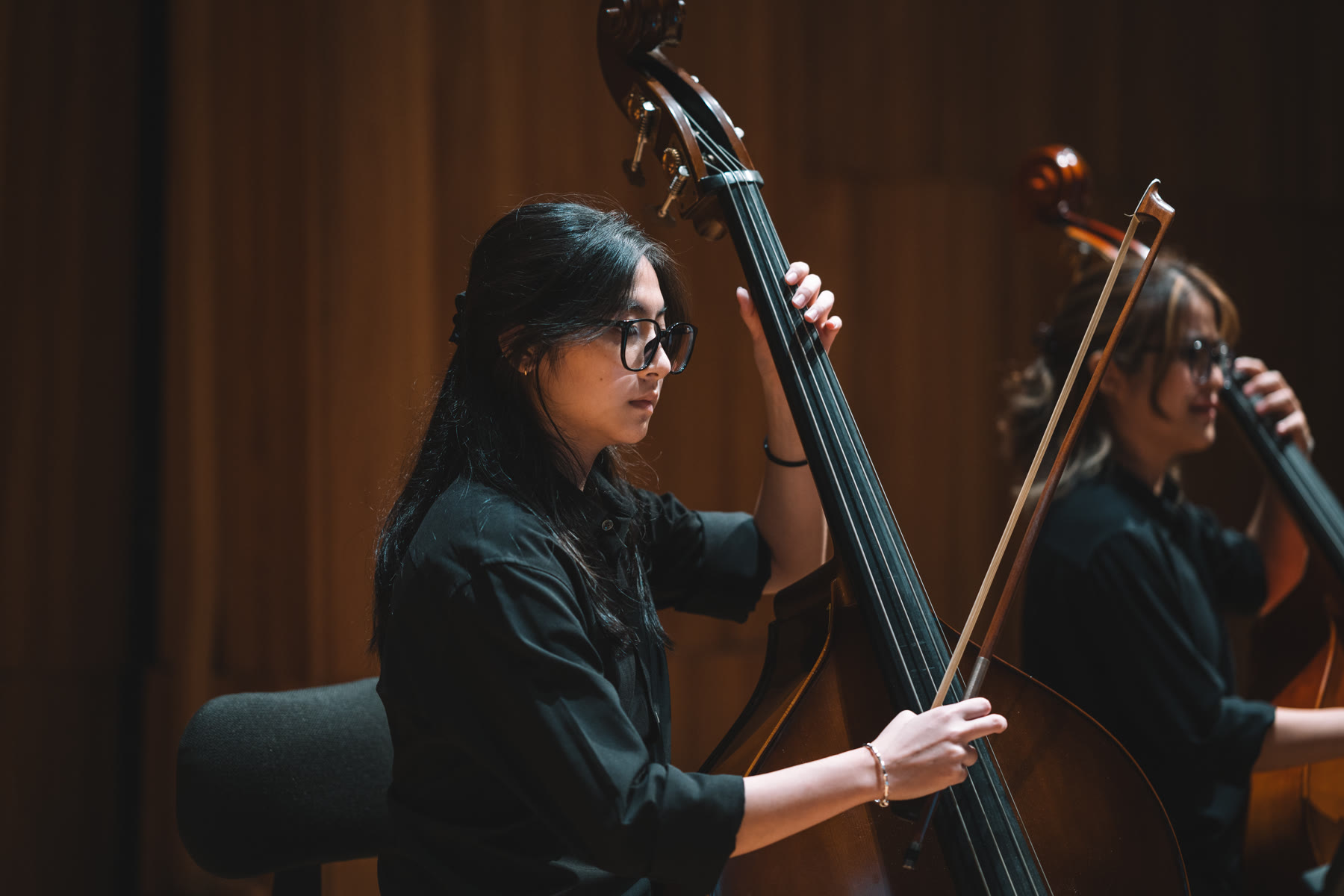 NTUSO double bassist performing on stage