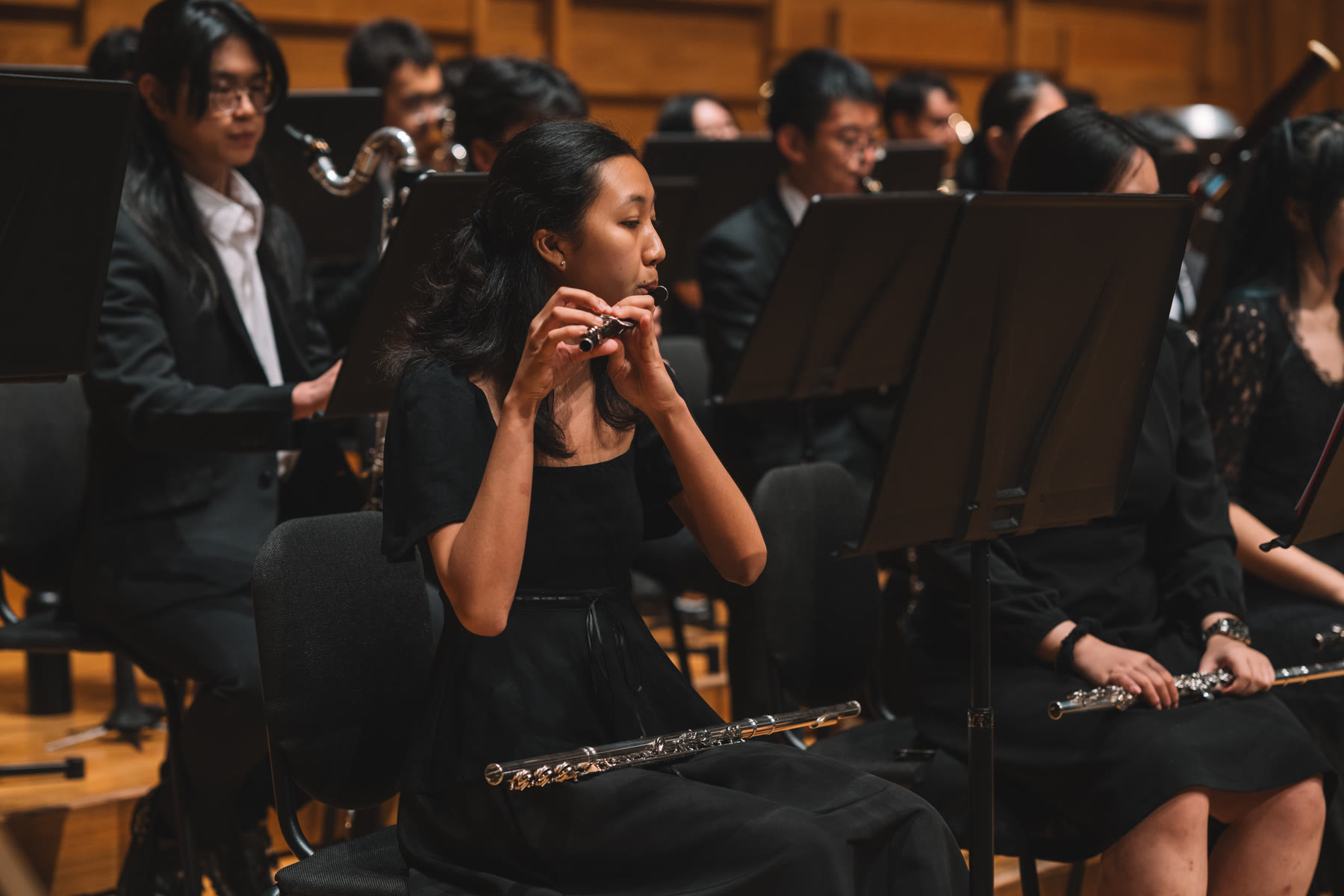 NTUSO musician playing the piccolo during a concert
