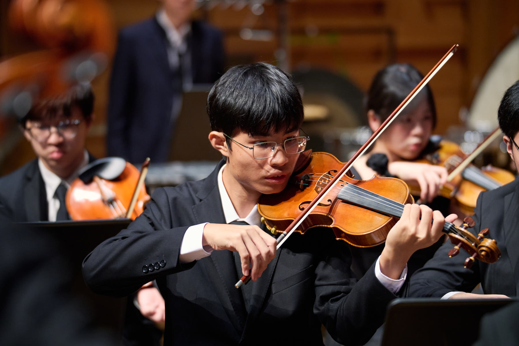 NTUSO violinist performing on stage