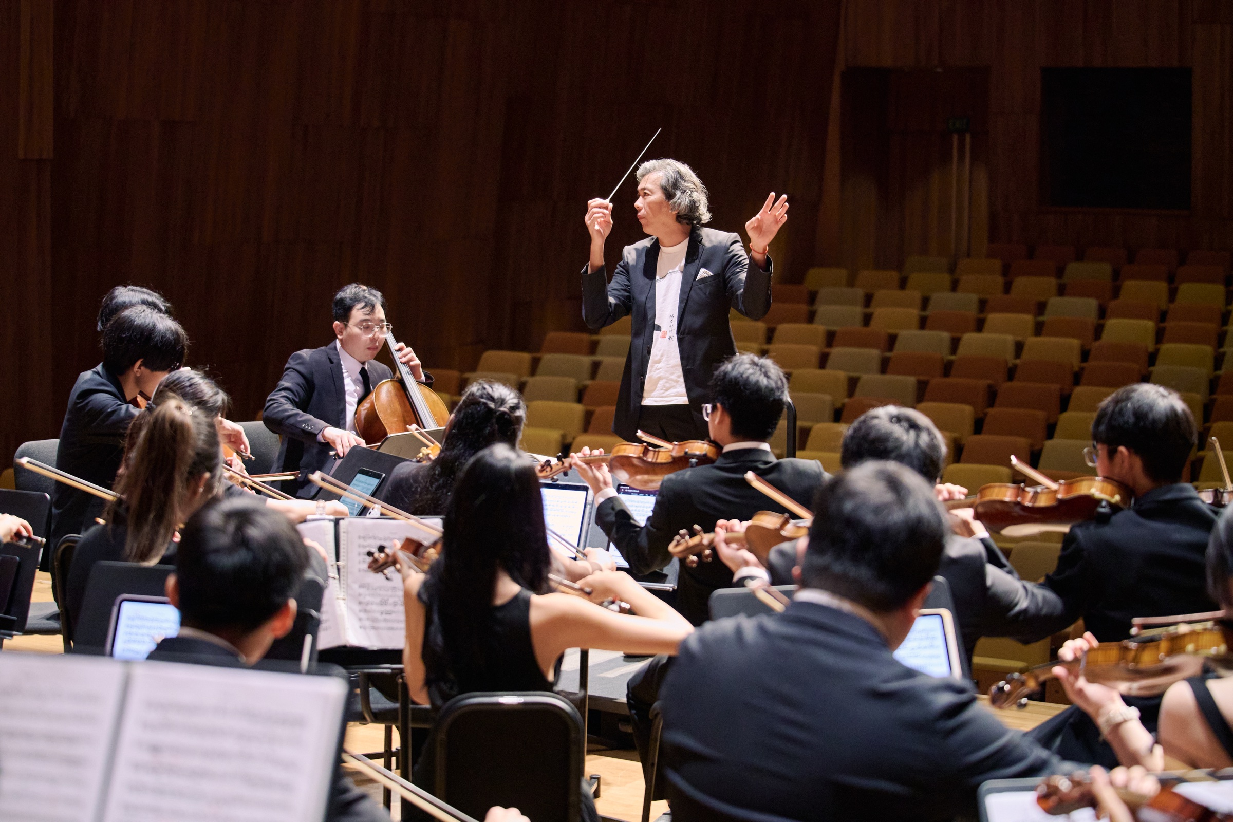 NTUSO musicians rehearsing with their conductor