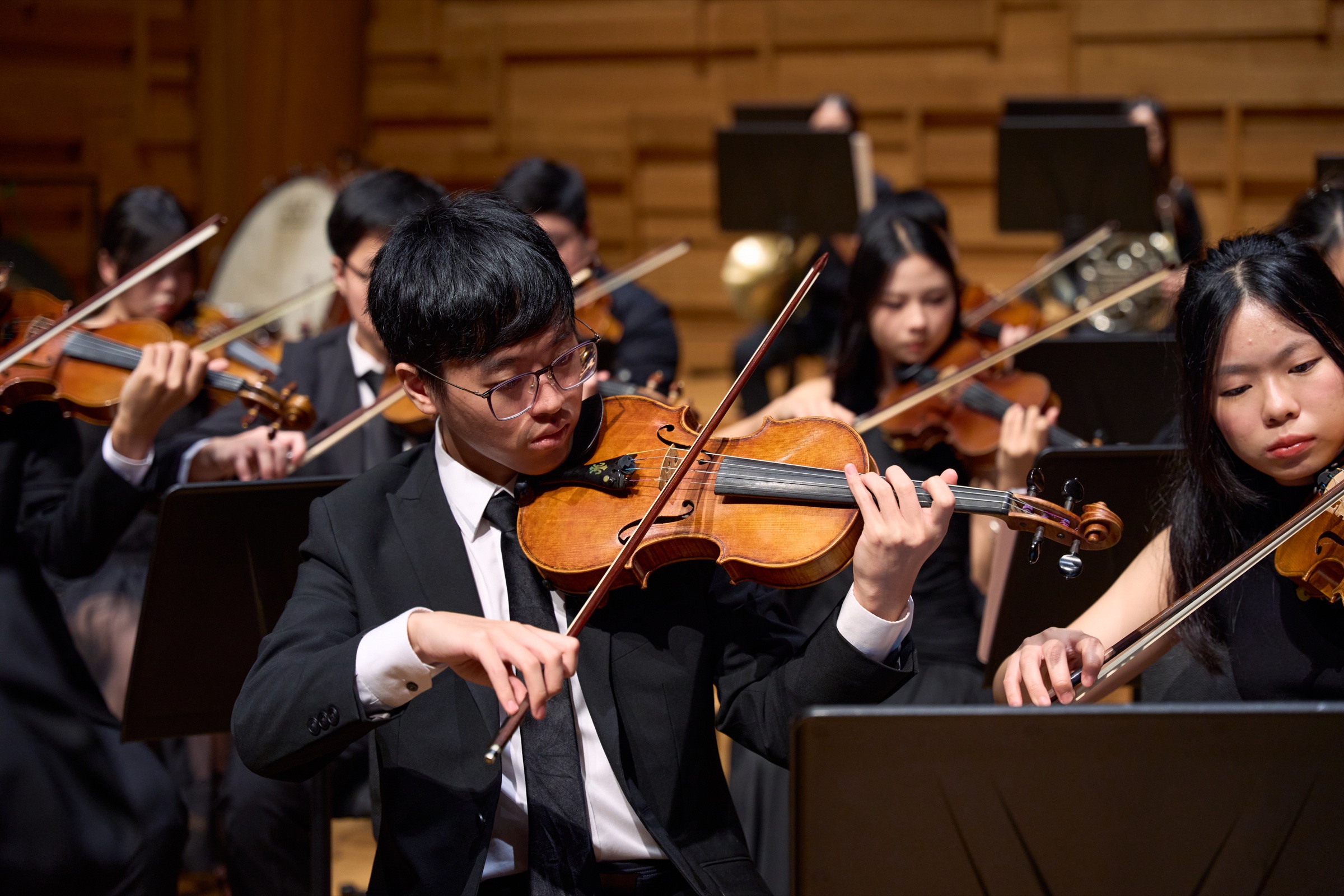 NTUSO string musicians performing together